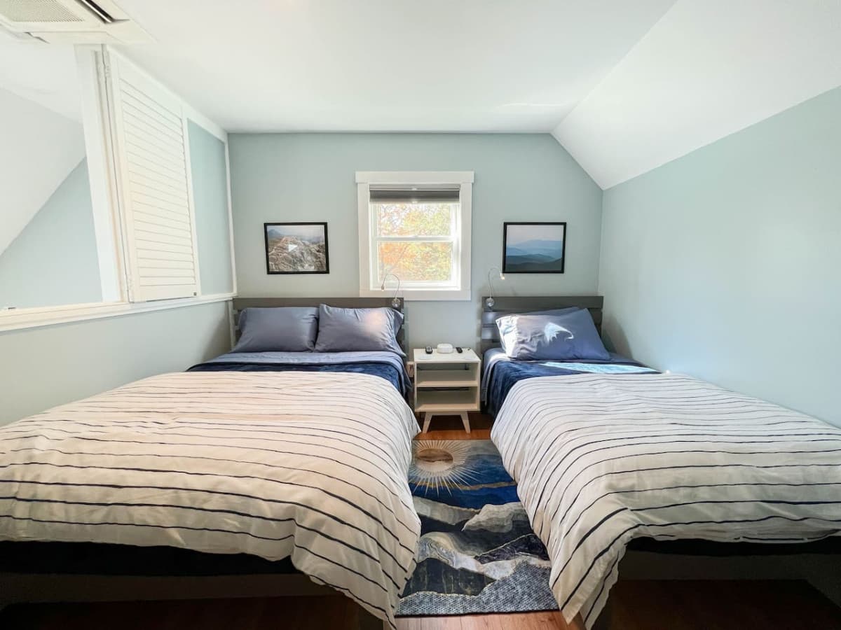 The Loft bedroom features a full-size and twin bed. It overlooks the main room, but can be closed off with the shutters at bed time.