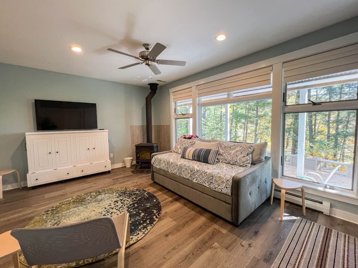 The fully finished basement offers a queen-sized Murphy bed and a twin daybed with additional twin trundle. Perfect for a family of 4!