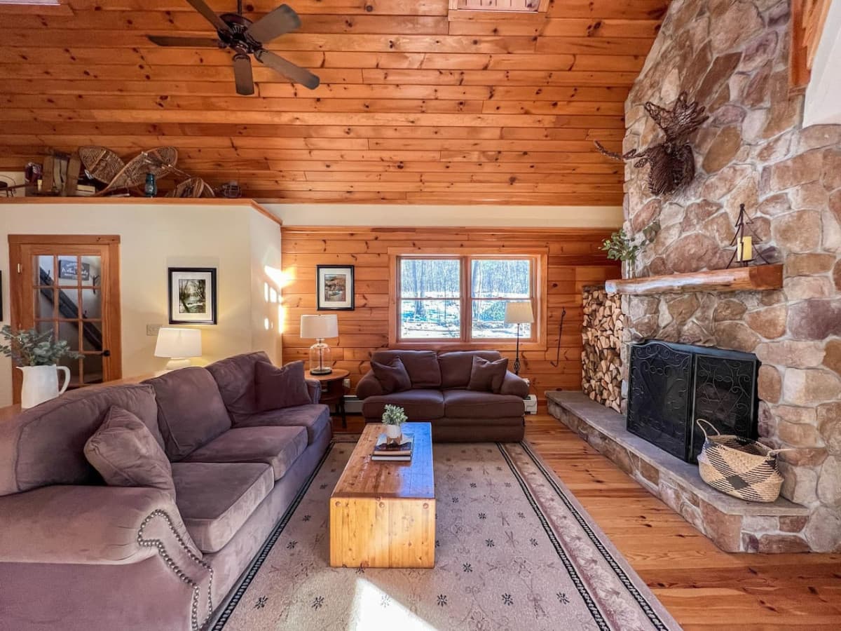Living room 1 of 2 plus wood burning fireplace.