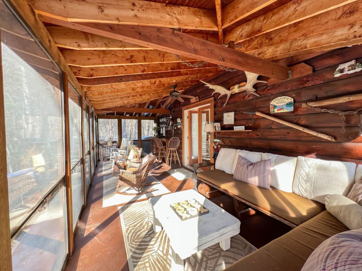 Arguably the most popular space in the log cabin - THE SCREENED-IN PORCH!  This large and spacious addition is a perfect place to relax with your morning coffee or your favorite beverage.
