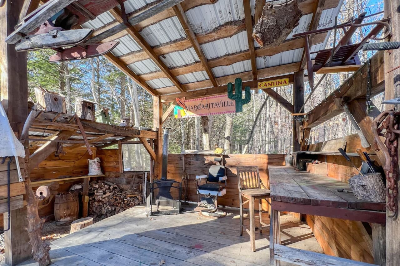 Used as an outdoor workshop, this space is a fun nod to nature with homemade projects and a collection of antiques.