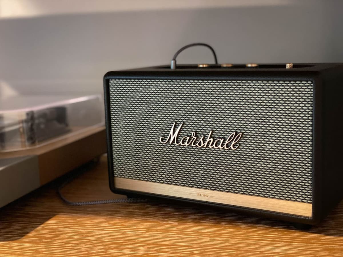Marshall bluetooth speaker next to the record player and a personal selection of records for your listening pleasure.