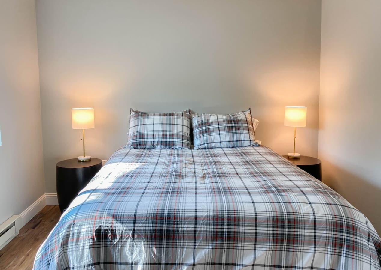 Second floor bedroom showing the queen size bed.