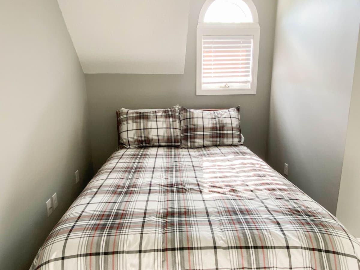 The cozy nook in the second bedroom with a full size bed.