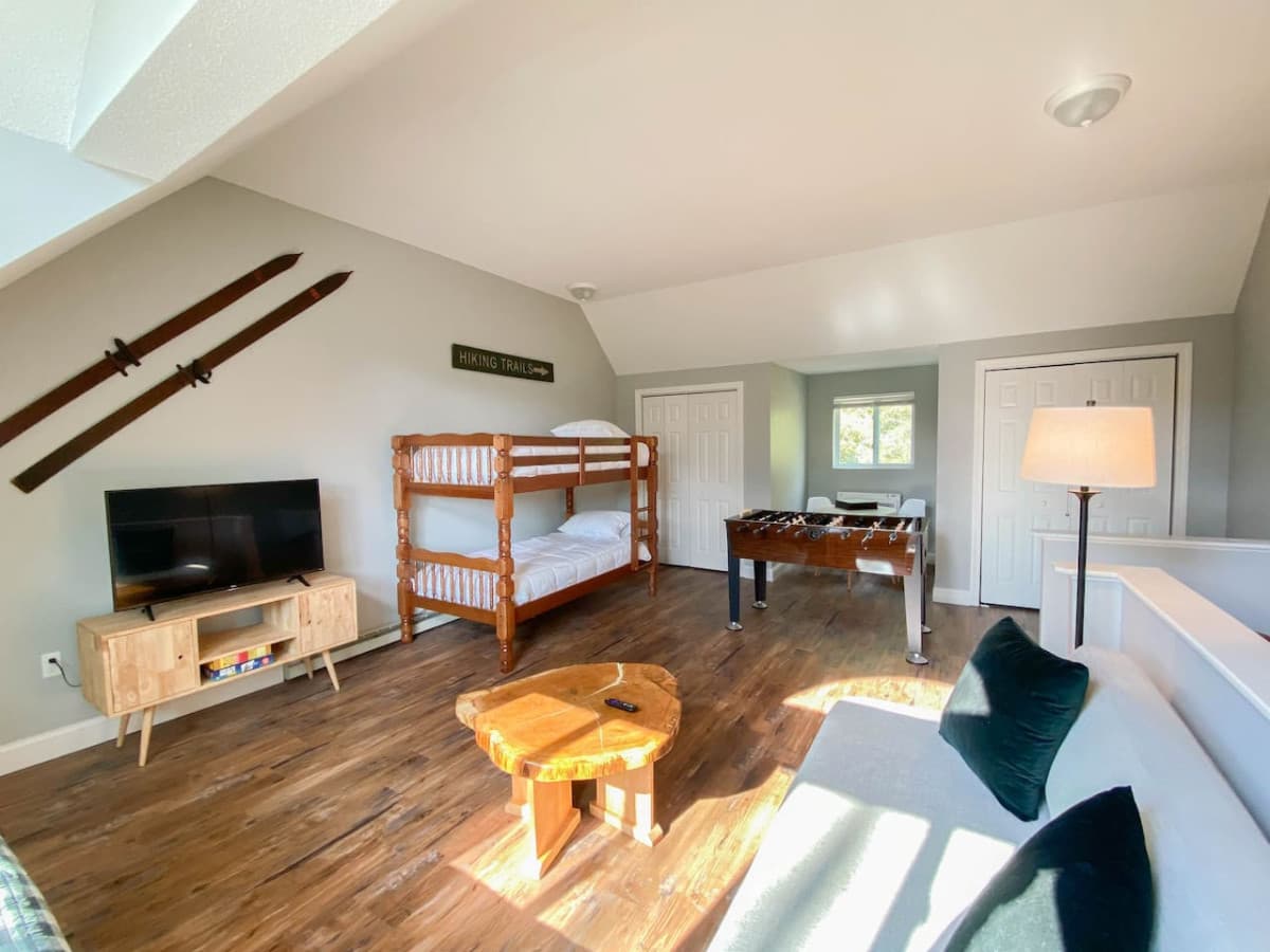 The third floor kids hangout with bunk bed, foosball, games, and plenty of comfortable seating.