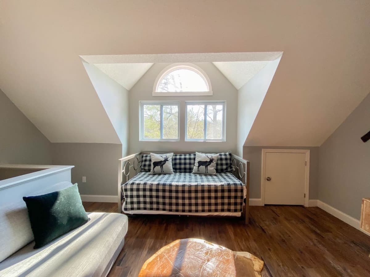 A comfortable day bed with lots of pillows - a perfect place for an afternoon nap.