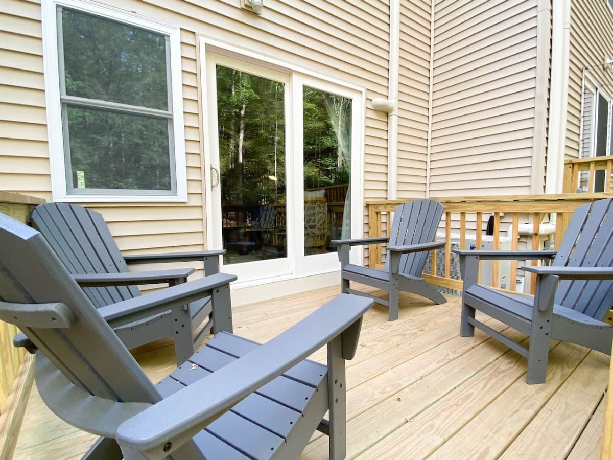 Adirondack chairs on the back deck. Enjoy a cup of coffee while listening to the peaceful sounds of the brook in the distance.