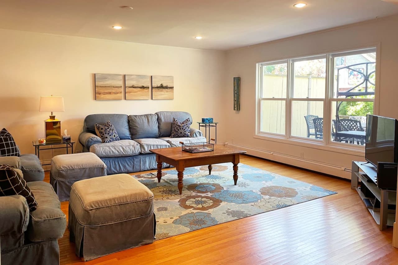 The comfortable family room is located at the back of the house, overlooking the deck and yard. Here you'll find the TV that has cable, Netflix and a Wii gaming system!