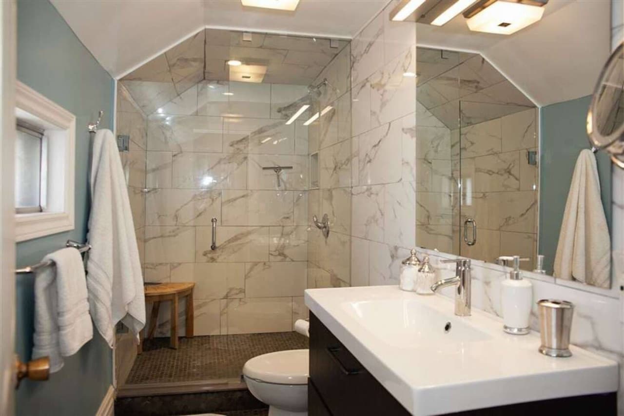 The main house bathroom is on the upper level and has a large glass stand-up shower. It is easily accessible from all of the bedrooms.