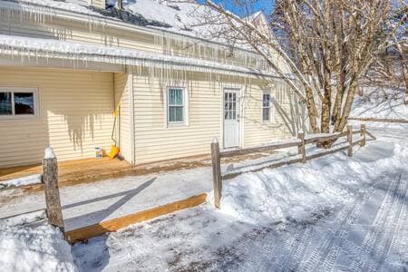The entrance to the first floor space. And a large deck for warm weather enjoyment.