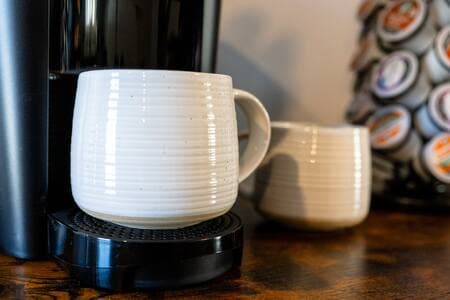 A Keurig and drip coffee maker, so pick your favorite option. Stocked with CloudSplitter Coffee.