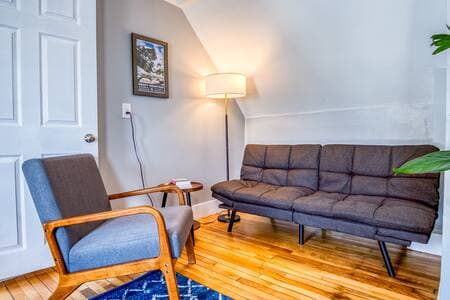 A comfortable sitting area with a sofa bed for a 3rd guest.