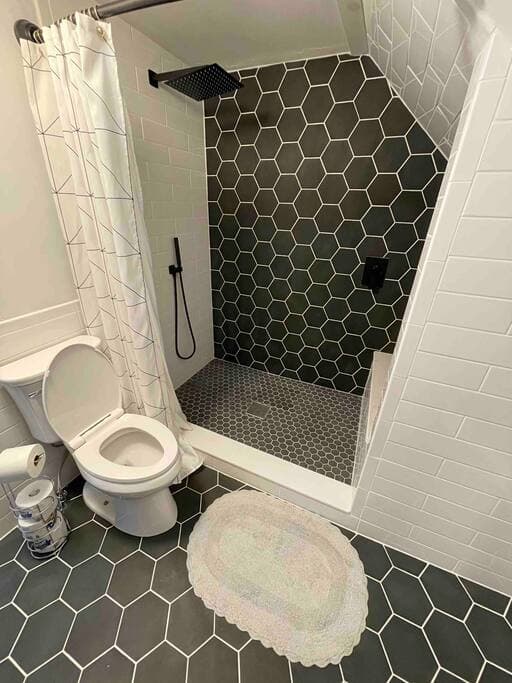 Extra large shower with rain shower head and spray wand