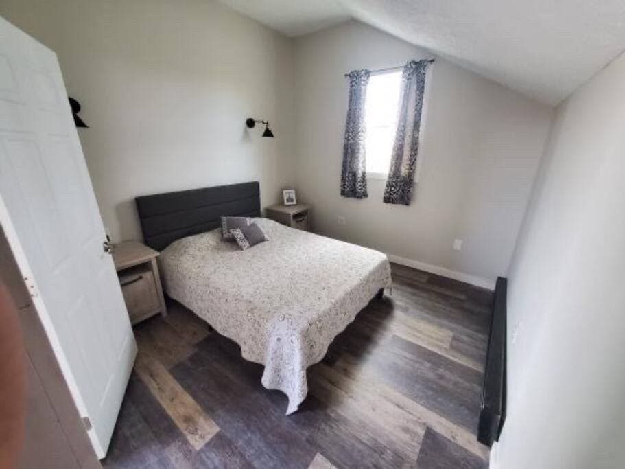 Master bedroom with queen bed