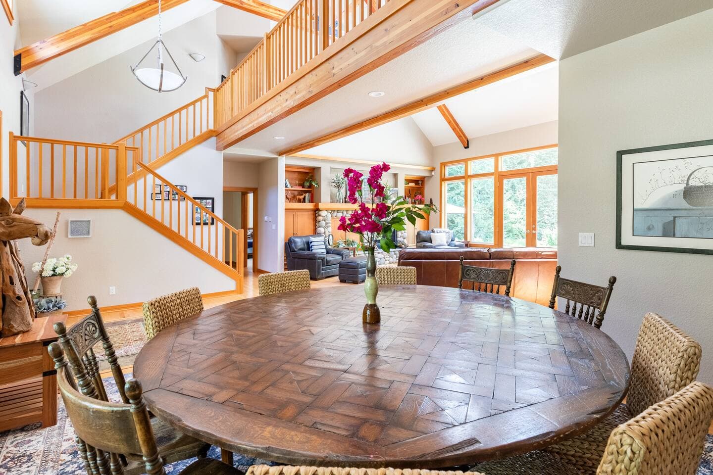 Seating for 10-12 at the dining table, plus 4 at the bar, with additional indoor tables available.
