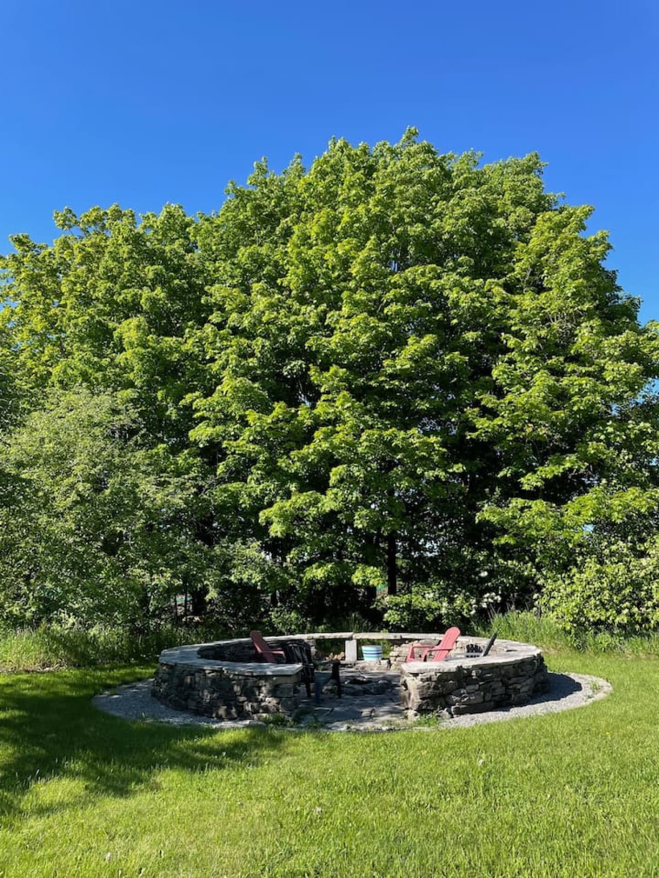 The huge back yard features a custom-made stone surround fire pit! Wonderful memories to be made while roasting marshmallows and telling stories around the fire. A small supply of wood will be provided to get you started.