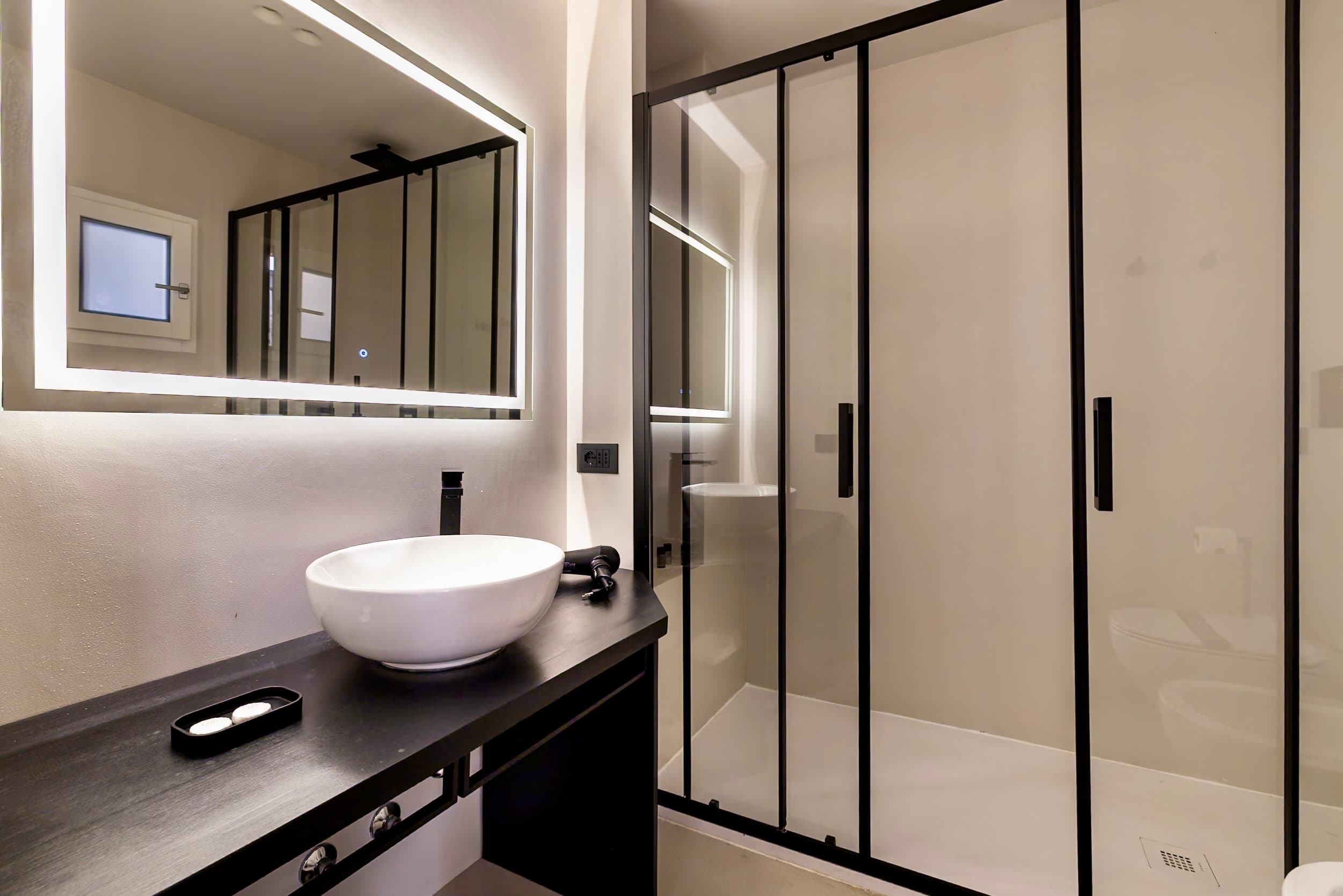Modern black fixtures give the space an elegant feel