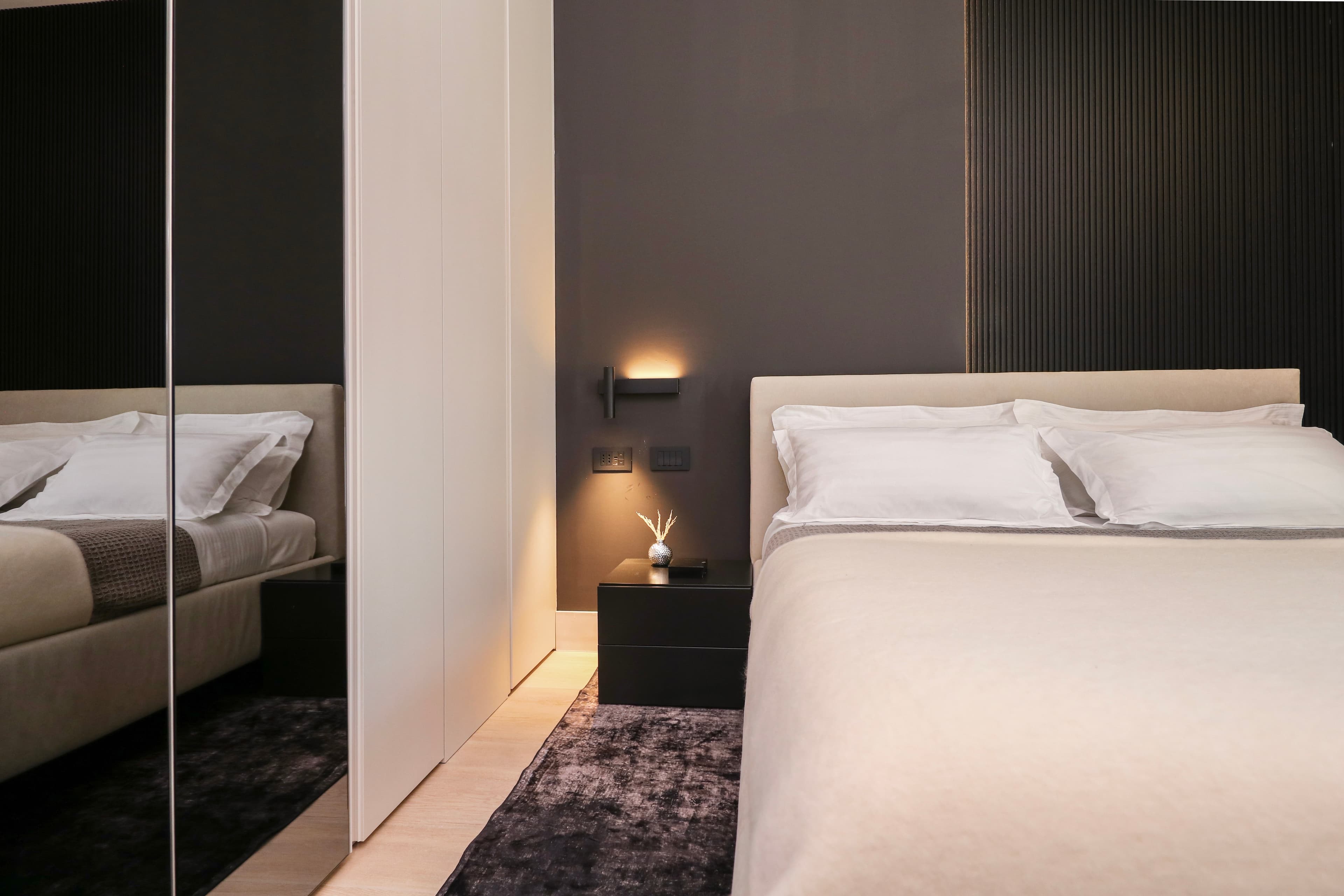 King-sized bed with crisp white Linens