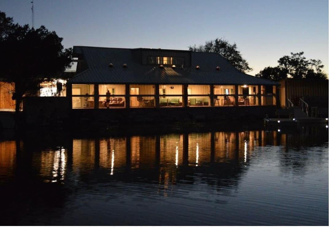 Lake Godstone Texas Family Reunion Lodge at night