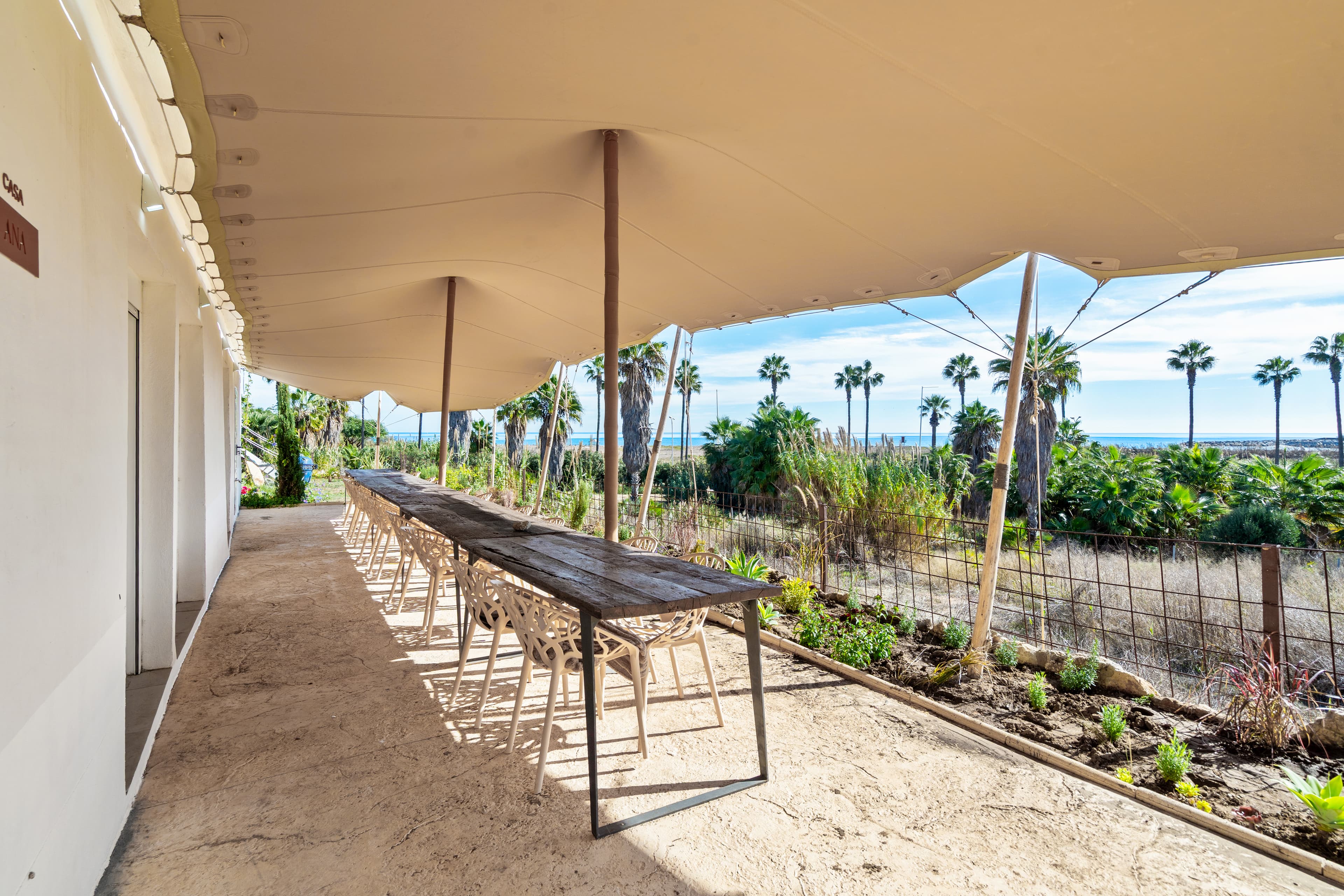 Waterproof shade canopy over dining area