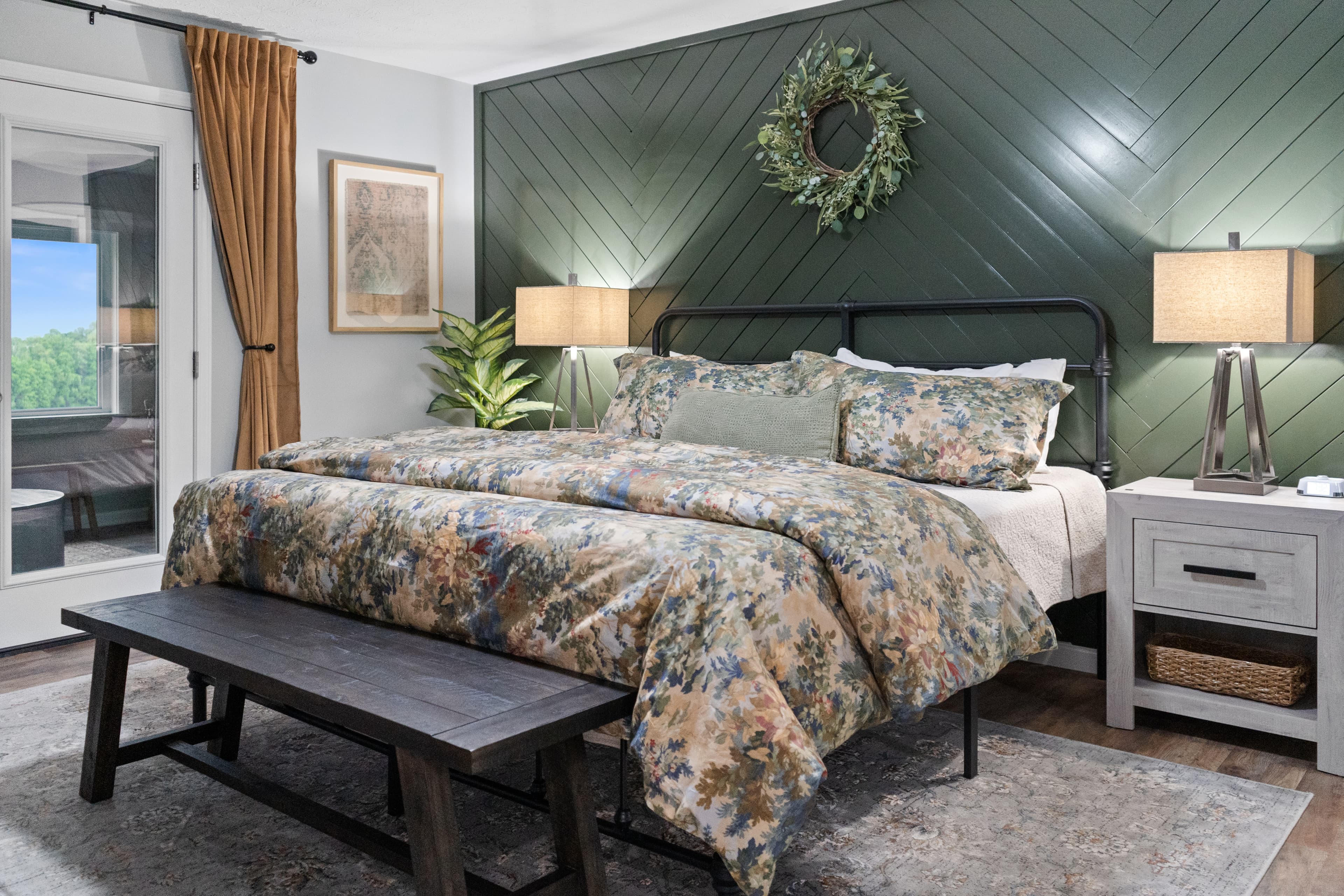 Primary Bedroom Main Level King sized bed and ensuite with access to Sunroom