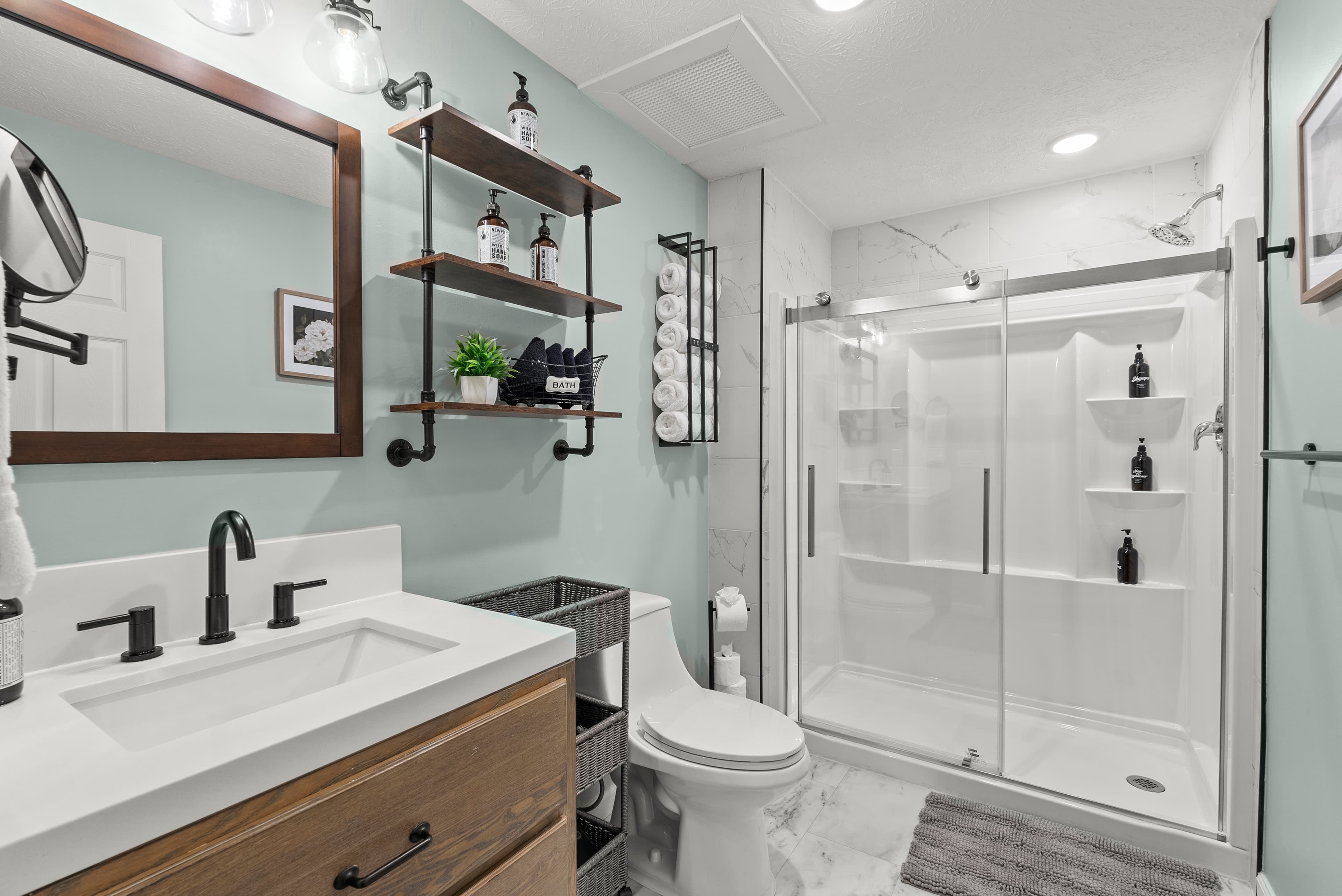 Main level primary ensuite: bathroom attached to main level king bedroom.