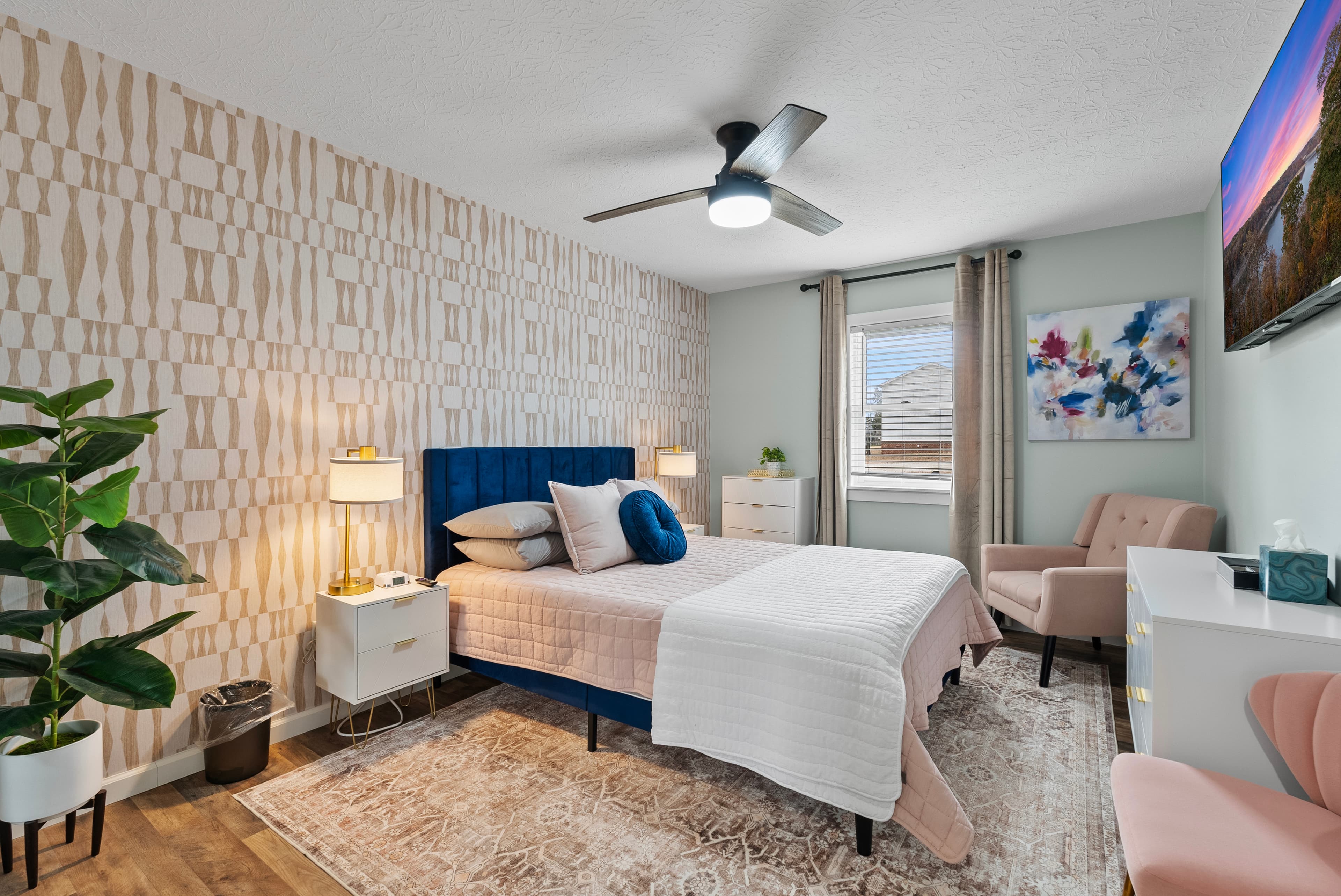 Main Level East: "Blush Retreat Bedroom" Queen bed, dresser, night stands, comfy chairs. Roku TV
