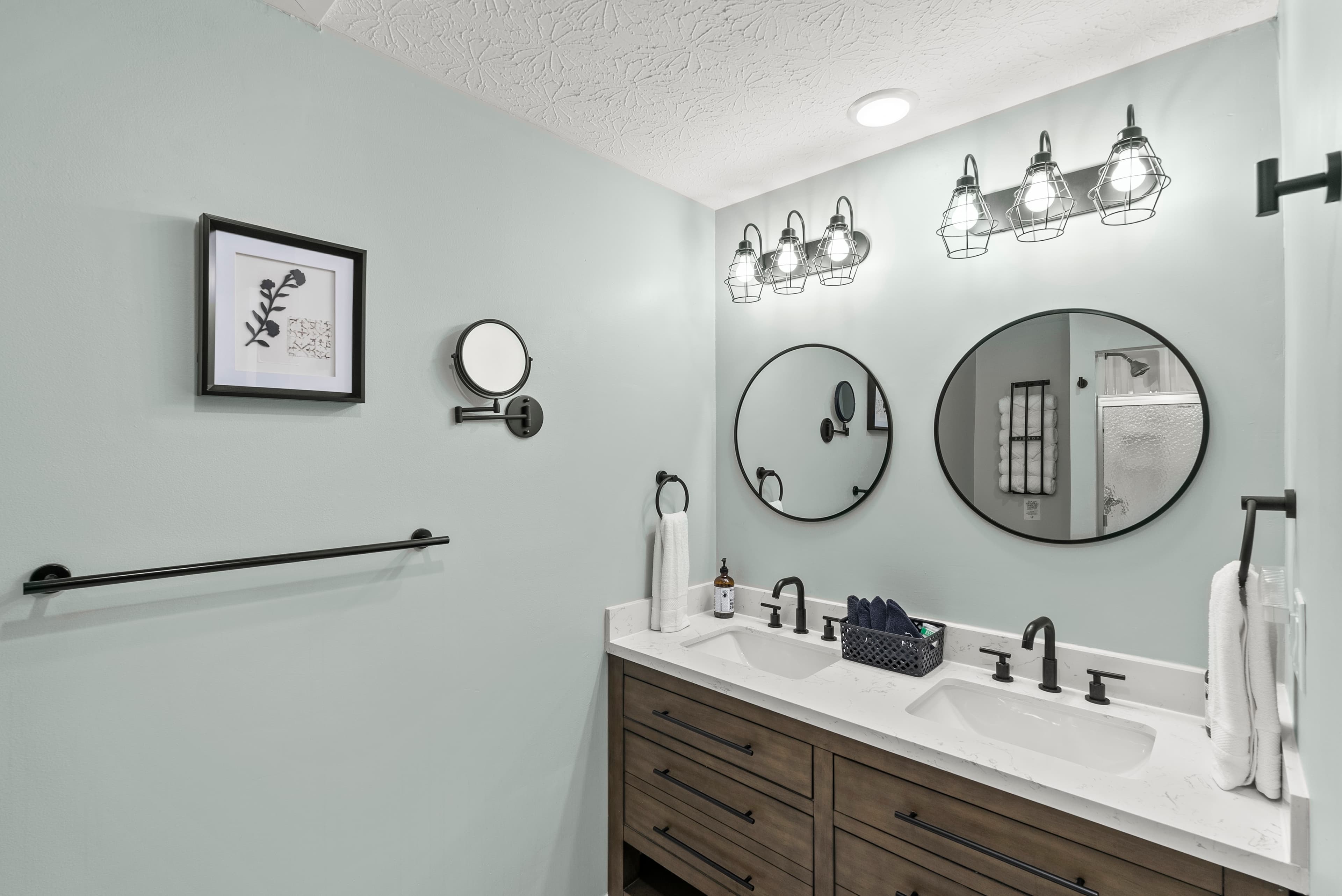Main level dual vanity bathroom. Has a shower/tub combo and services "Boho & Blush" bedrooms. 
