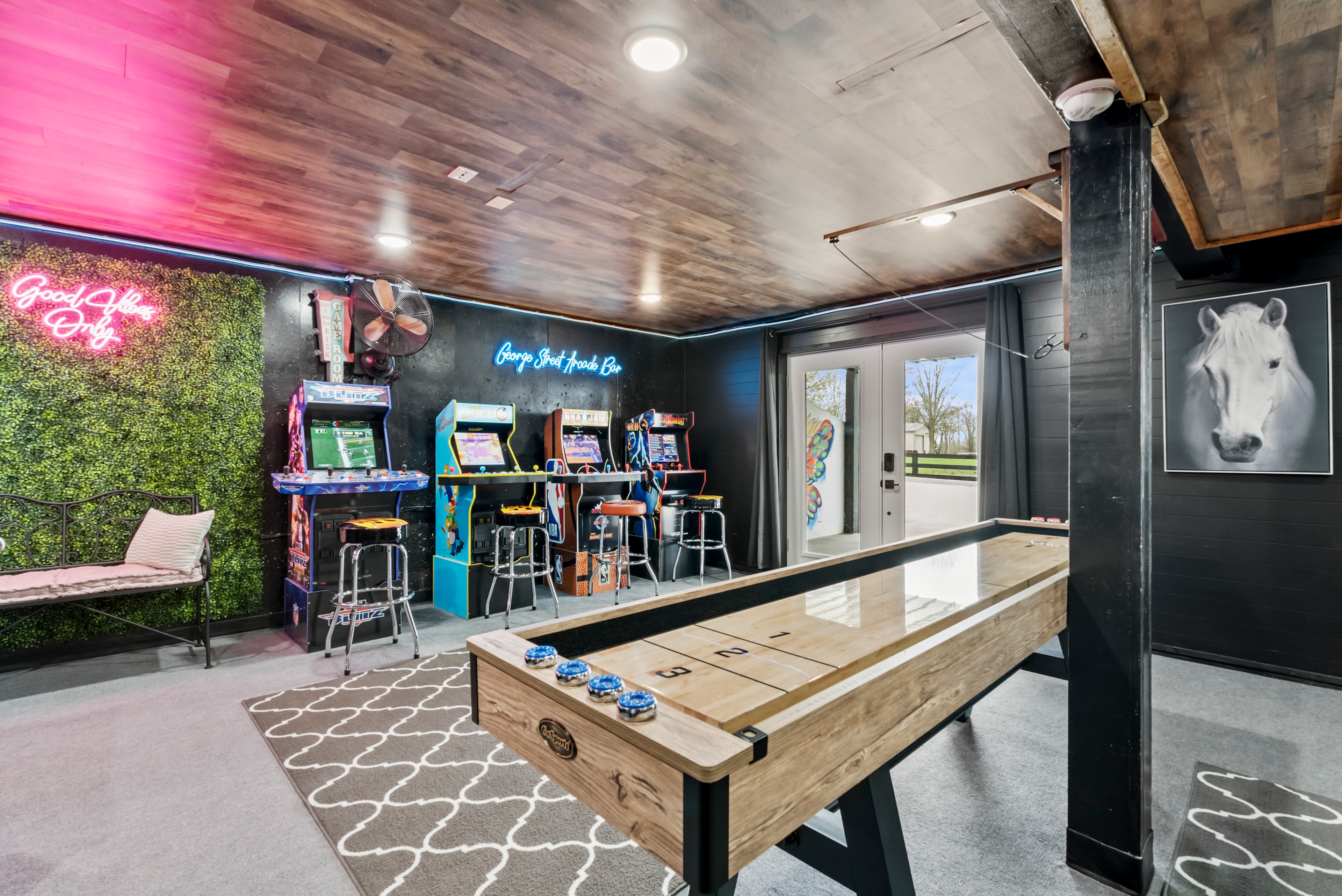 9 foot shuffle board table and two games of Hook and Ring. 