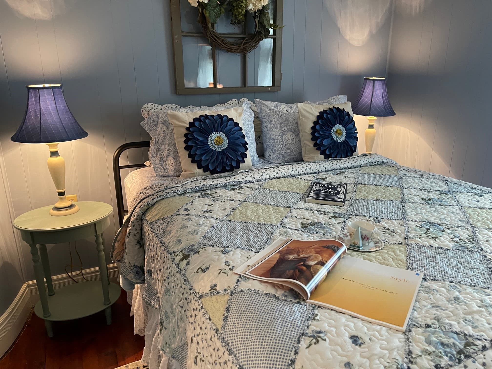 Main Street - Bedroom w Mirror on Dresser - Close up of Bed - Purple Pillows