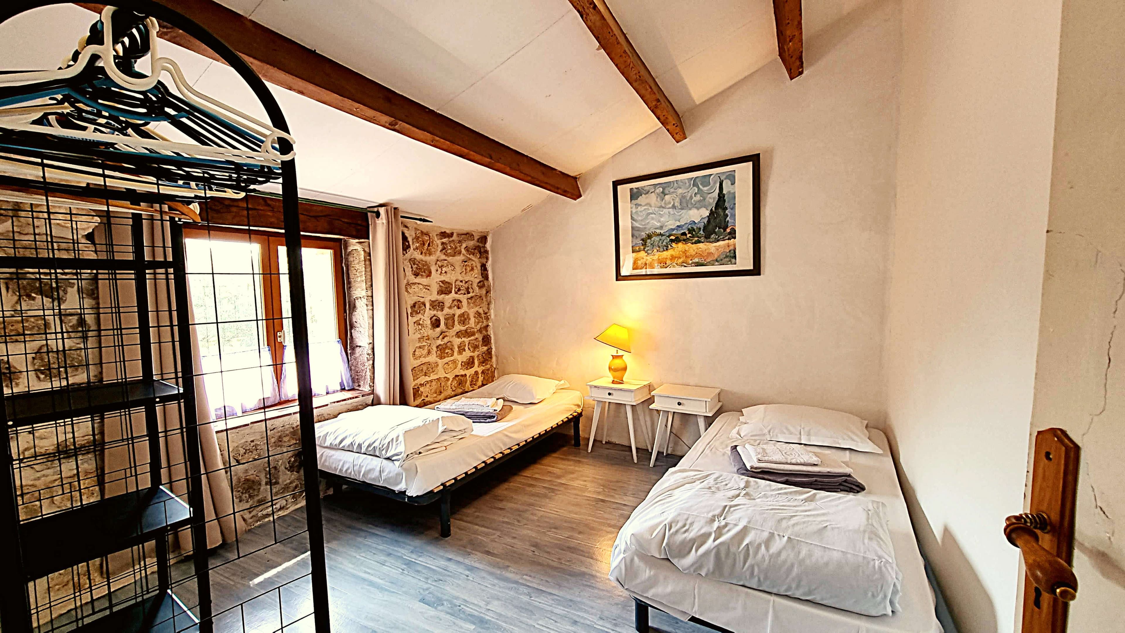 Warm bedroom with antique furniture in La Cave