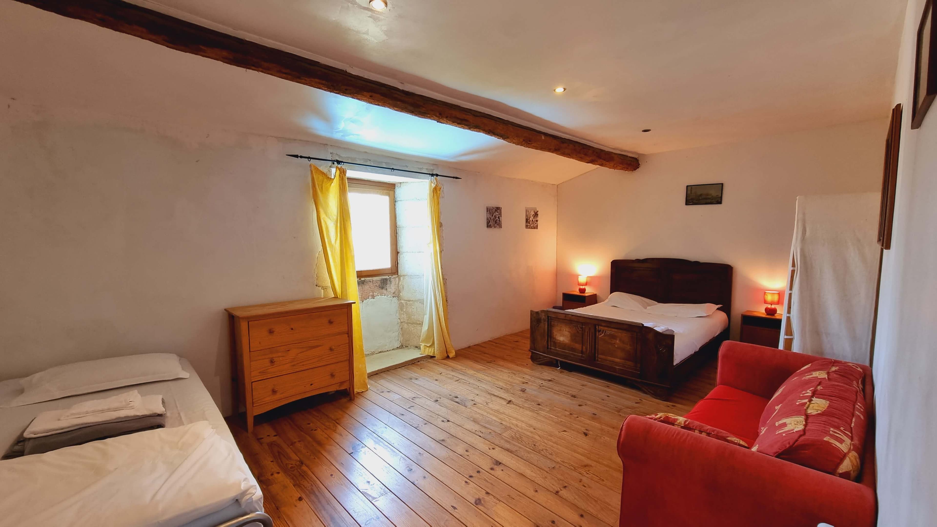 Master bedroom with natural light and vintage wardrobe