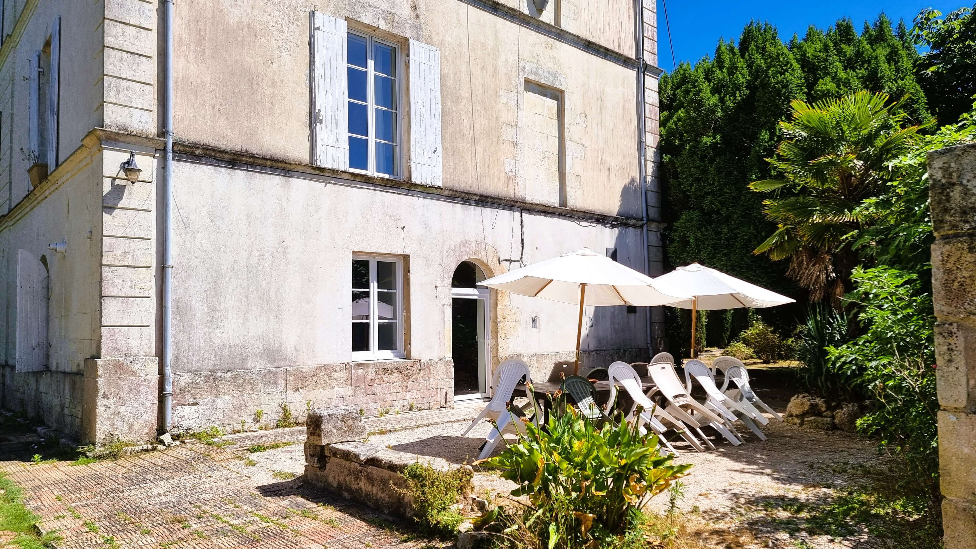 Castle facade with terrace and outdoor dining area