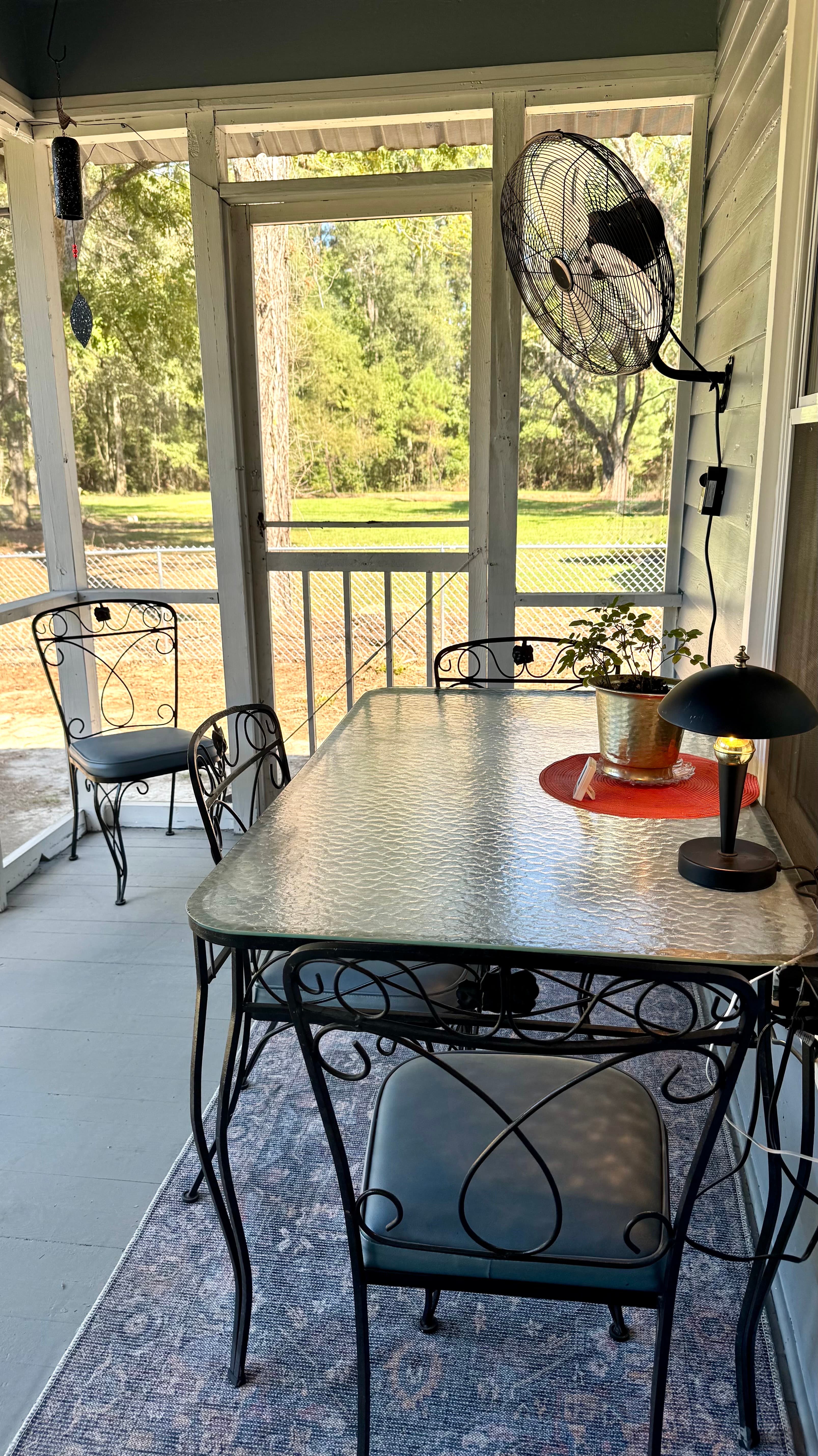Screened in back porch is perfect for morning coffee