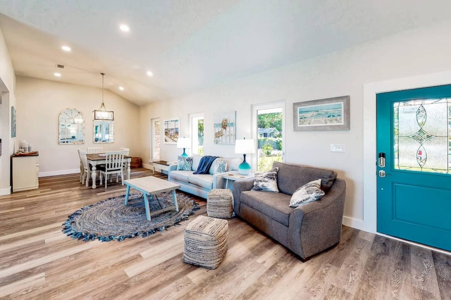This room has a sofa sleeper and a sectional with an extra large ottoman for extra sleeping. 