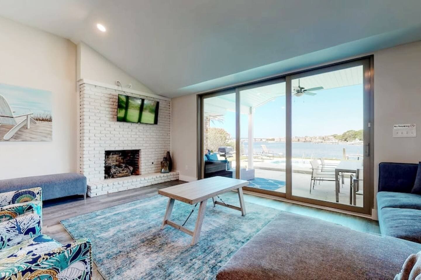 This room has a sofa sleeper and a sectional with an extra large ottoman for extra sleeping. 