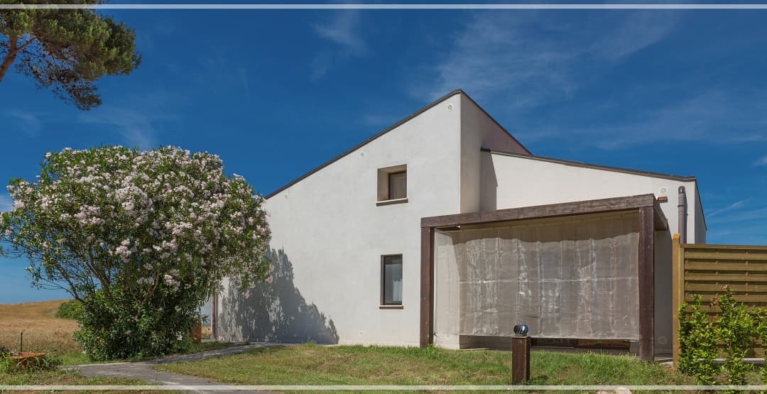 once the house was white painted, see the patio protected from wind