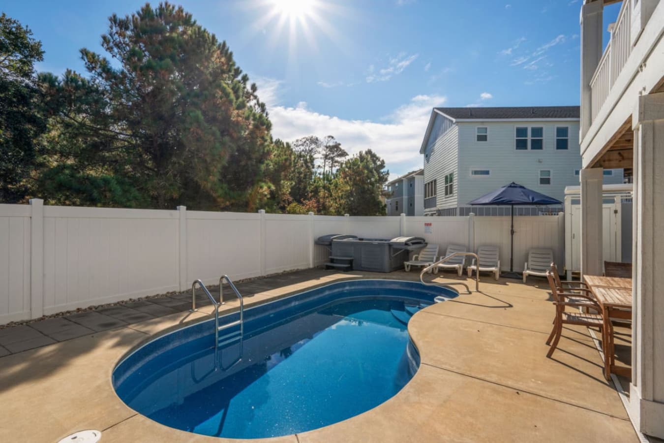 Private backyard pool w/ loungers, fence & space to soak up the sun
