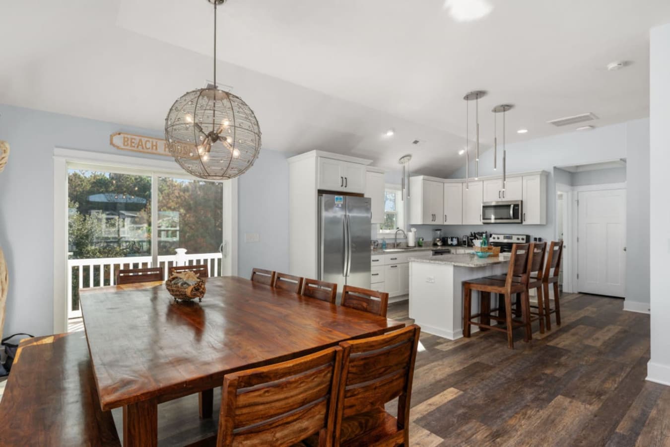 Dining area w/ large wood table, great for group meals & long conversations