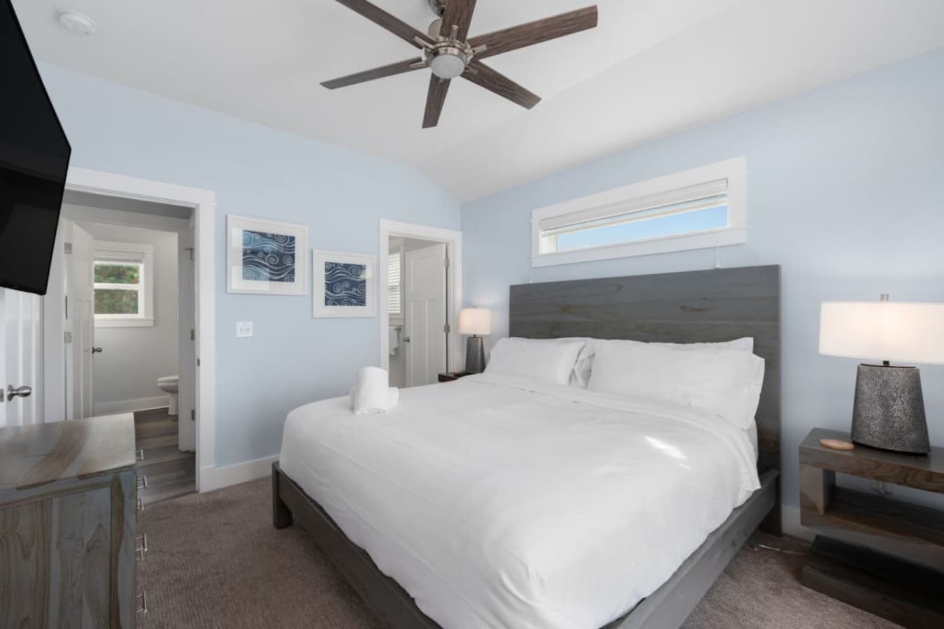 Calm coastal bedroom w/ soft tones, comfy bed & an easy, relaxed feel