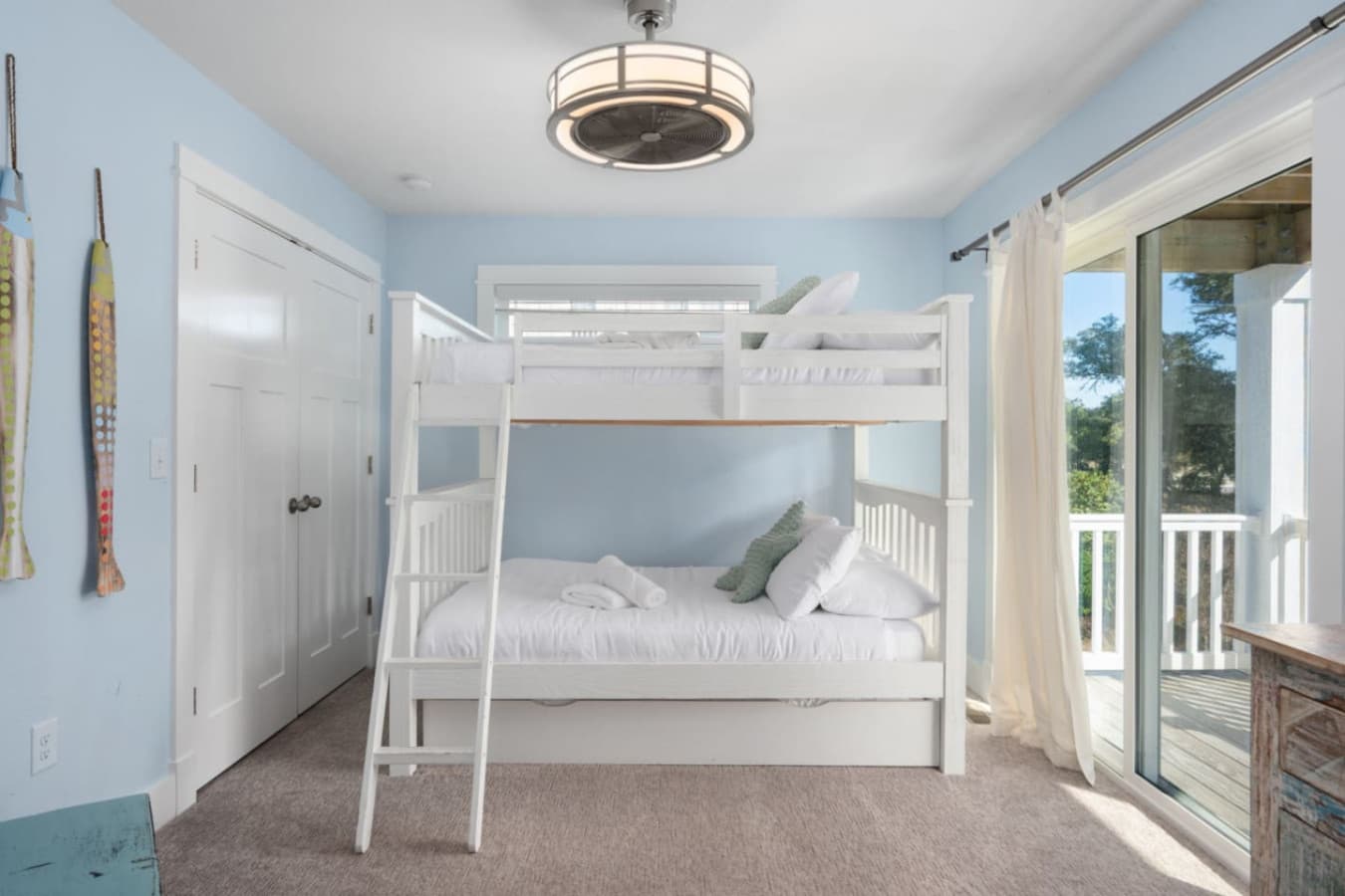 Bright bunk room w/ balcony access, perfect for kids or extra guests