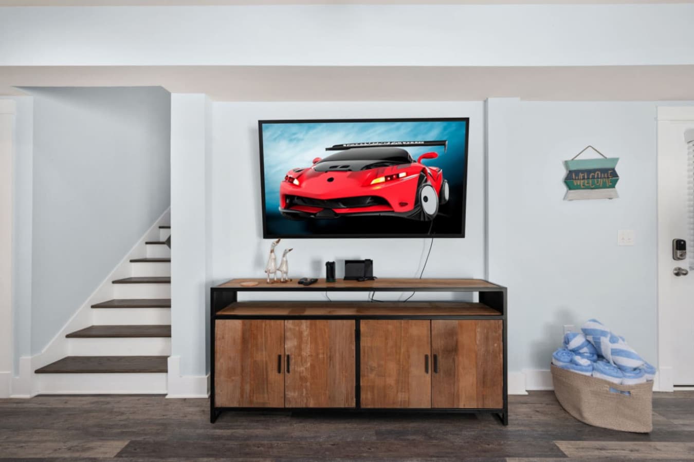 Game-ready hangout w/ big-screen TV, console & lounge seating