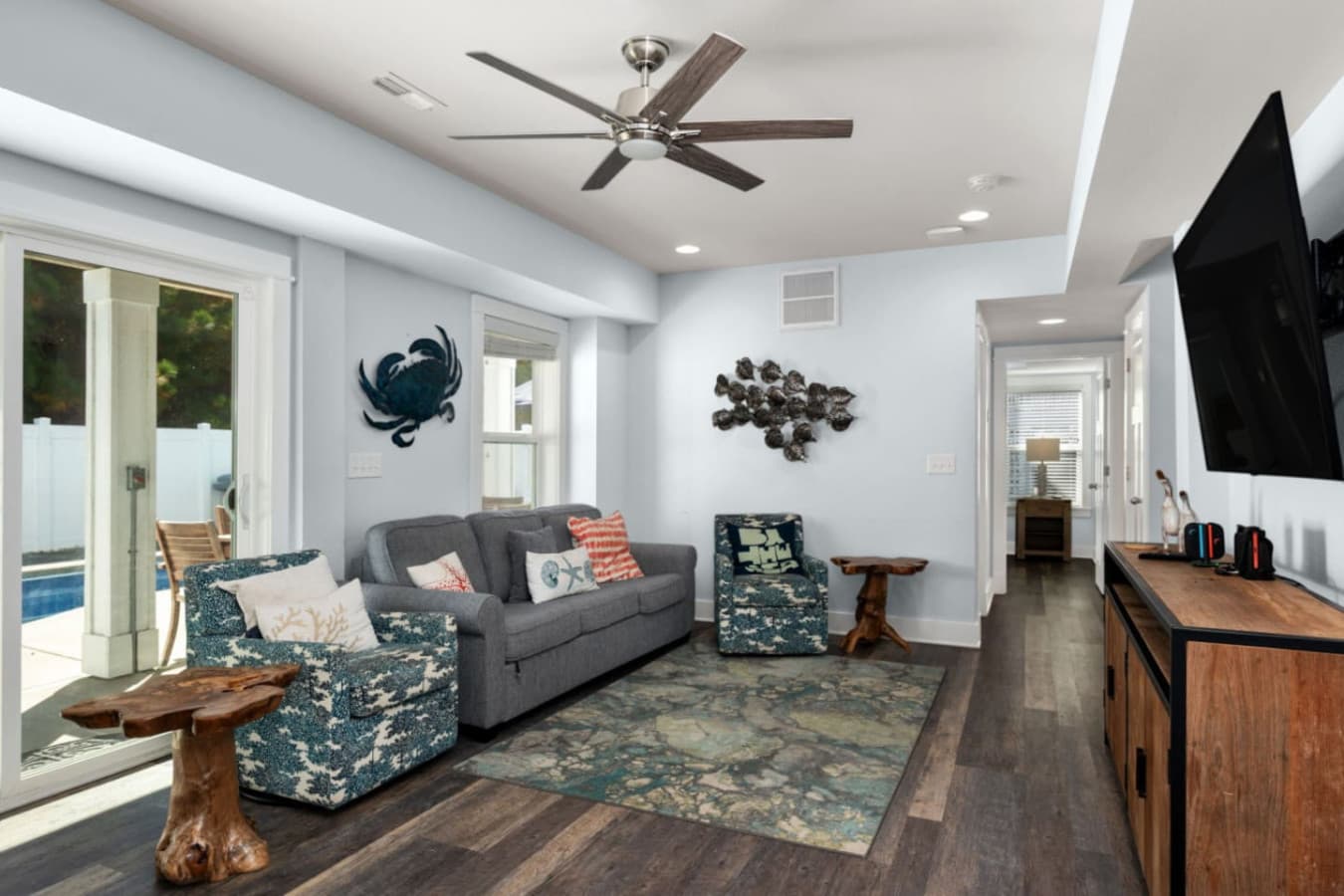 Inviting living area w/ comfy seating, ocean-inspired art & easy flow