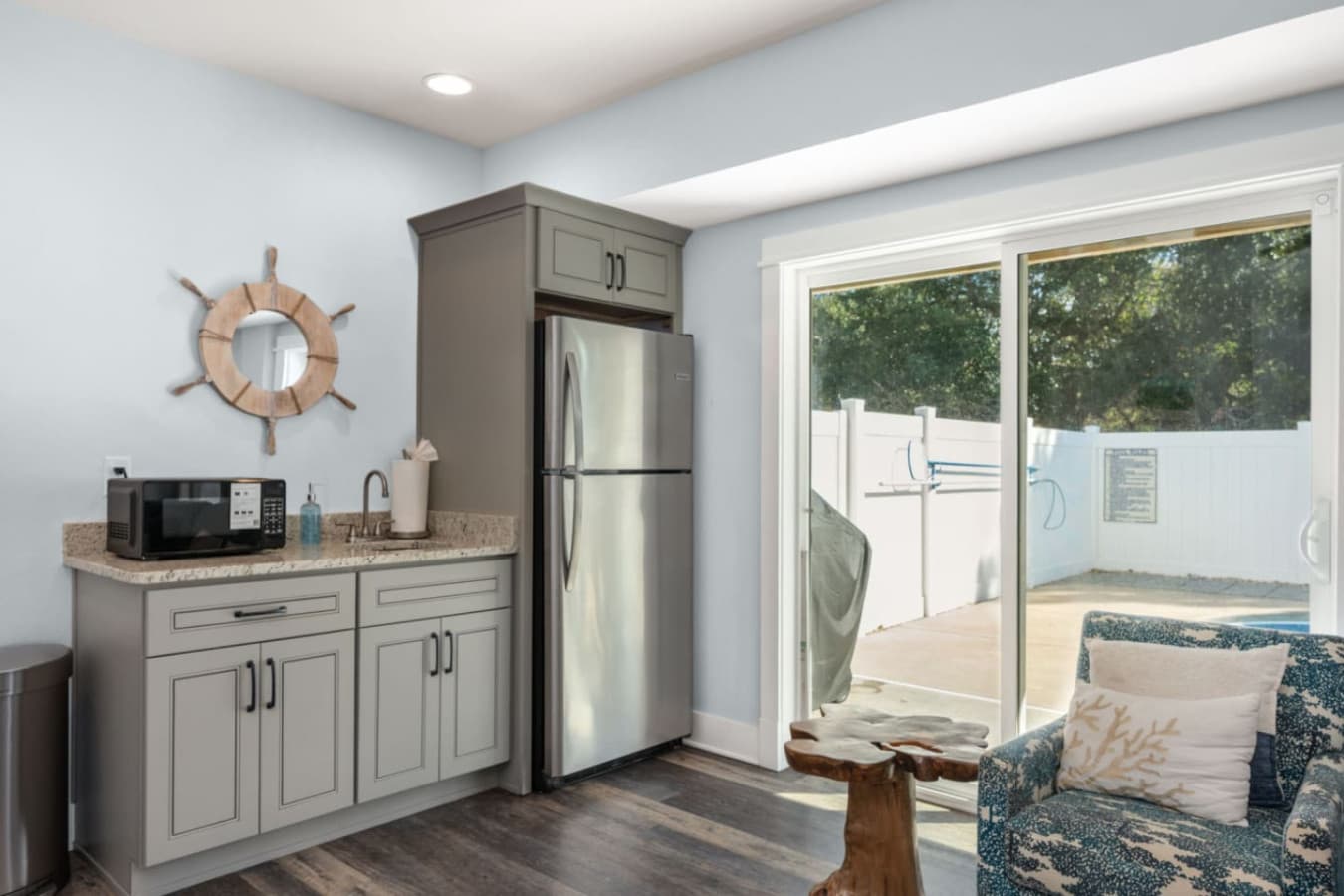 Poolside kitchenette w/ fridge & sink for easy snacks & drinks