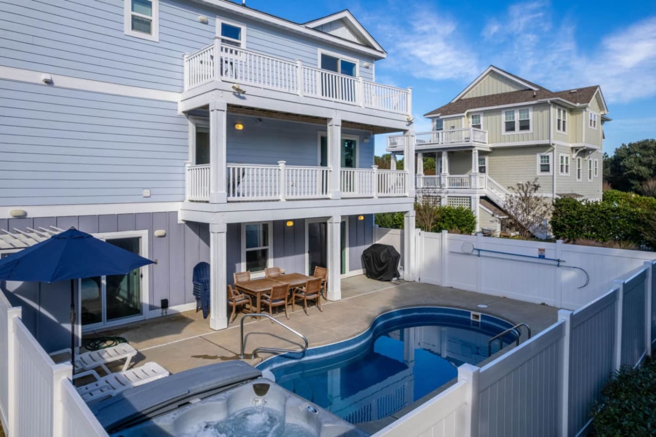 Private pool & hot tub in a fenced yard w/ umbrella dining table and grill just steps away.