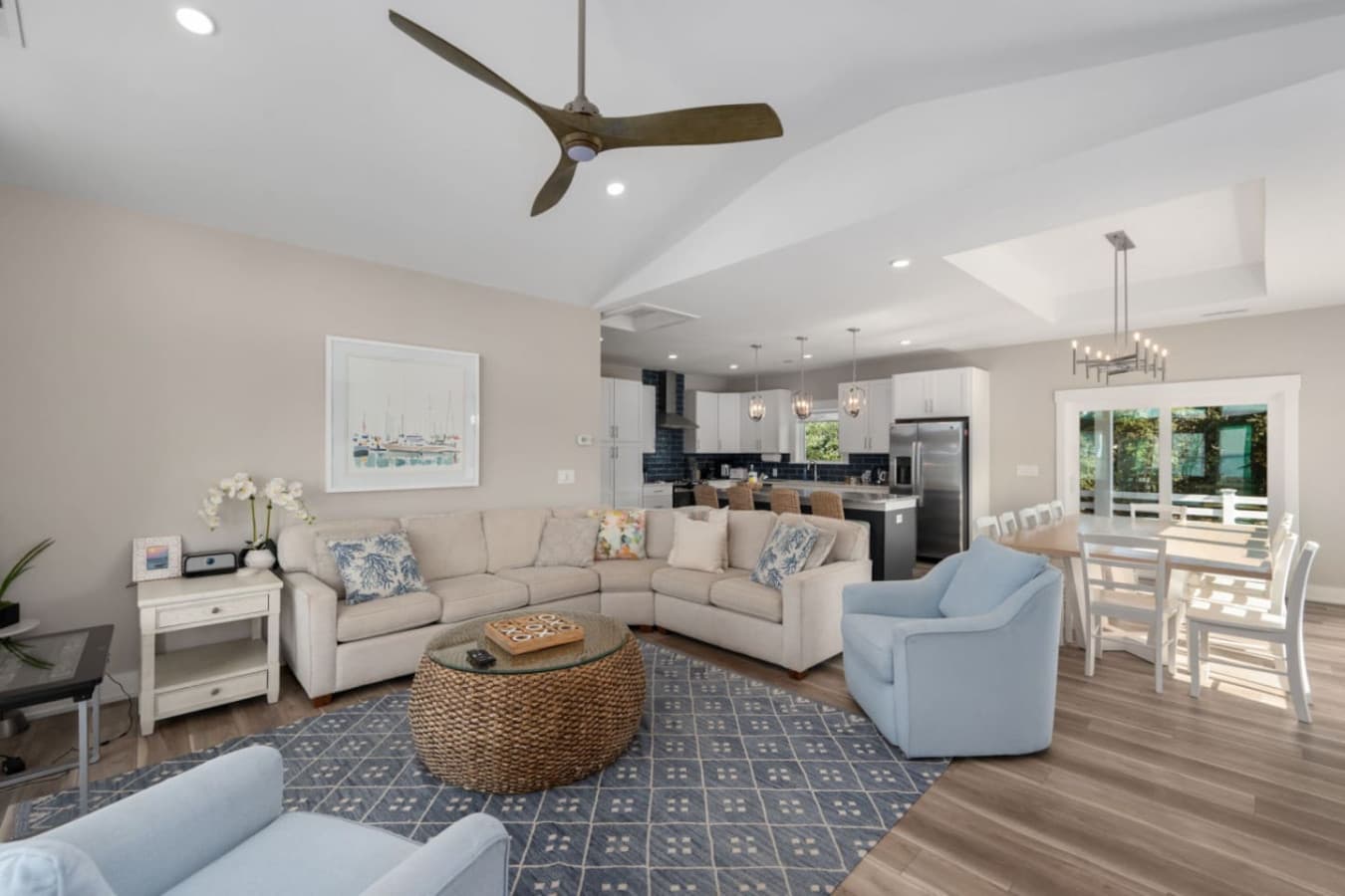 Seamless open-concept layout connecting living, kitchen & dining spaces.