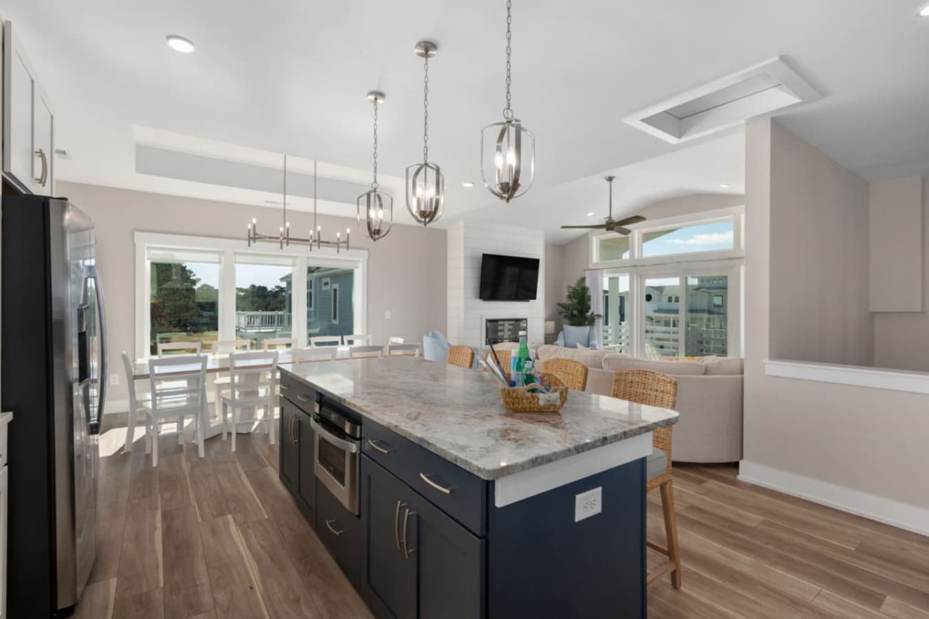 Spacious kitchen flowing into dining area, ideal for cooking & entertaining.