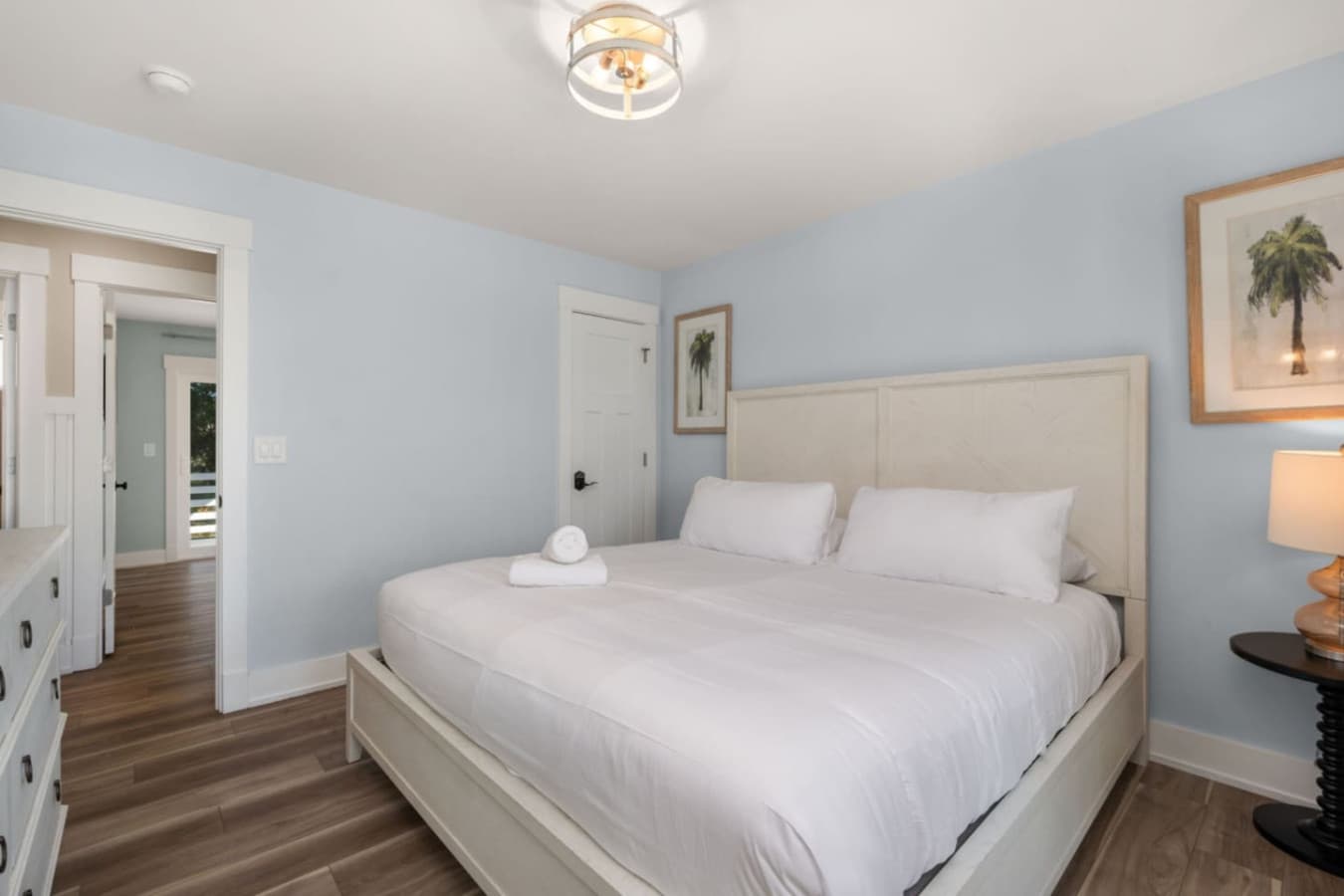 Peaceful bedroom w/ crisp linens, soft tones & a calming, airy feel.