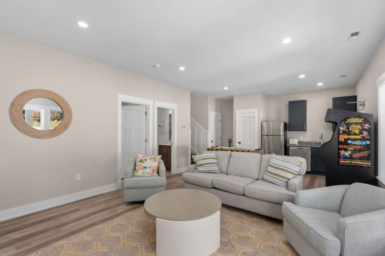 Cozy rec room w/ comfy seating, TV & space to unwind together.