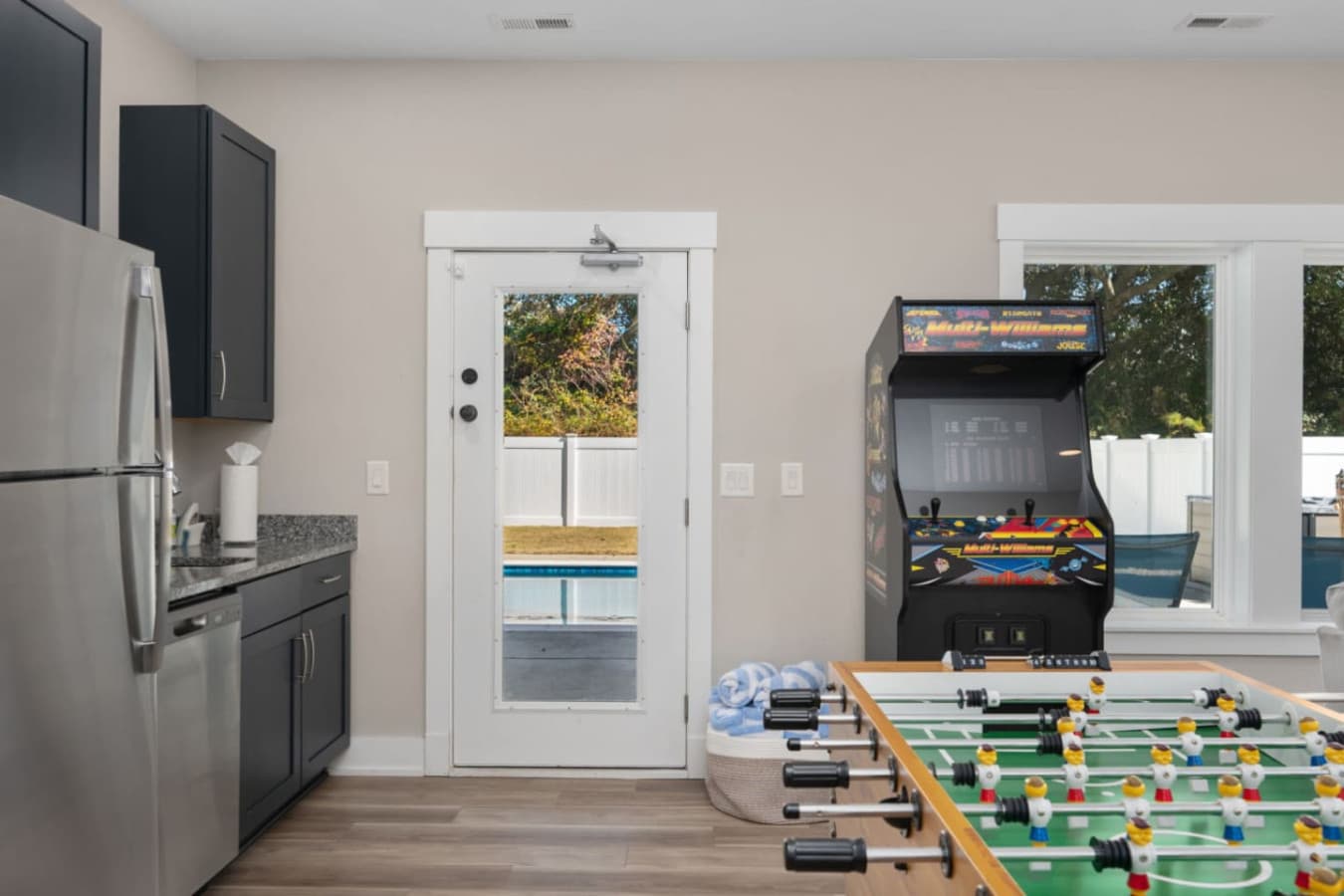 Arcade-style game room setup w/ classic machines for nonstop fun.